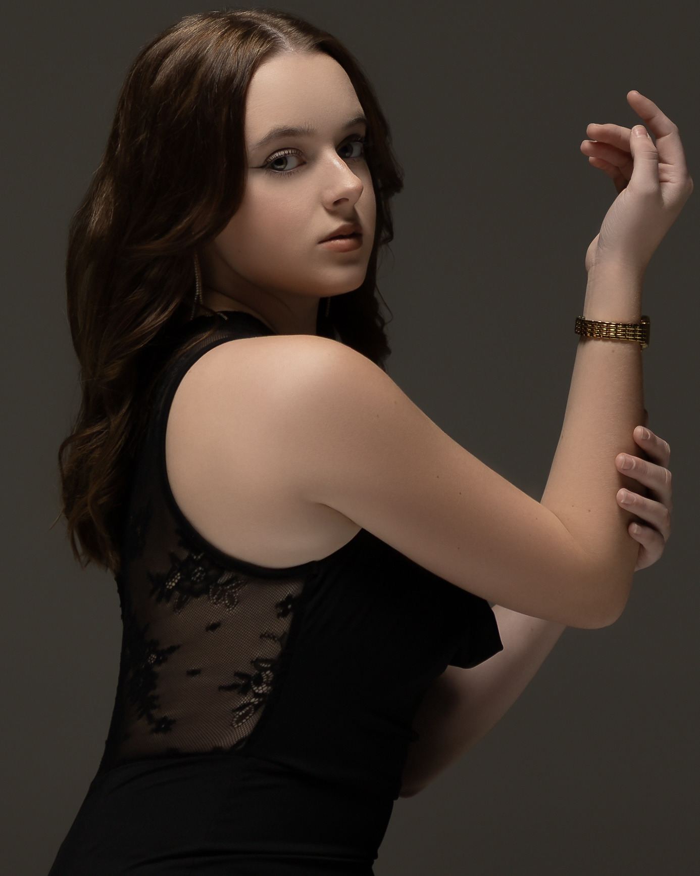Studio portrait in a black jumpsuit, elegant style - photograph 7